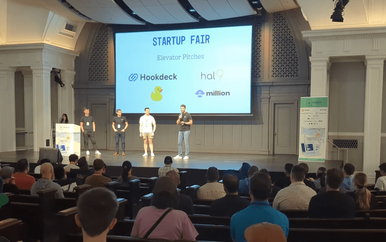 Kyle from Hookdeck on stage for CascadiaJS